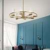 Elegant living room with teal blue wall with molding and bedroom behind white and glass wall with big baseboard Too High or Too Low? The "Golden Rule" For Hanging Pendant Lighting in Every Room